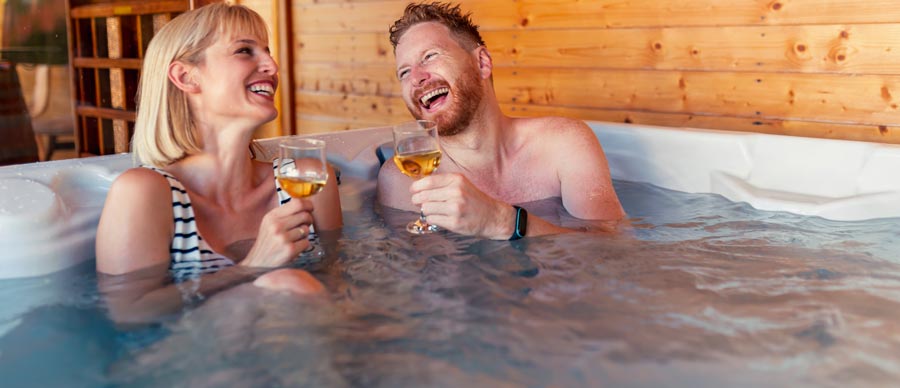 friends-drinking-wine-and-relaxing-in-a-hot-tub_2